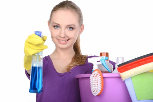 Vacuuming upholstered furniture to remove dust and debris